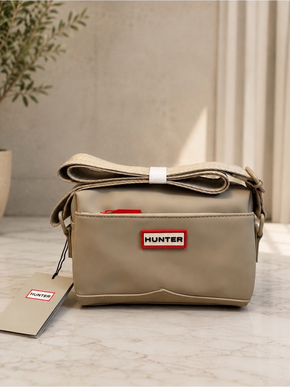 NWT Hunter Water Resistant
Crossbody Bag with Logo Accent, Beige